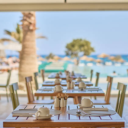 Paralos Kosta Alimia Breakfast decorated wooden tables and chairs
