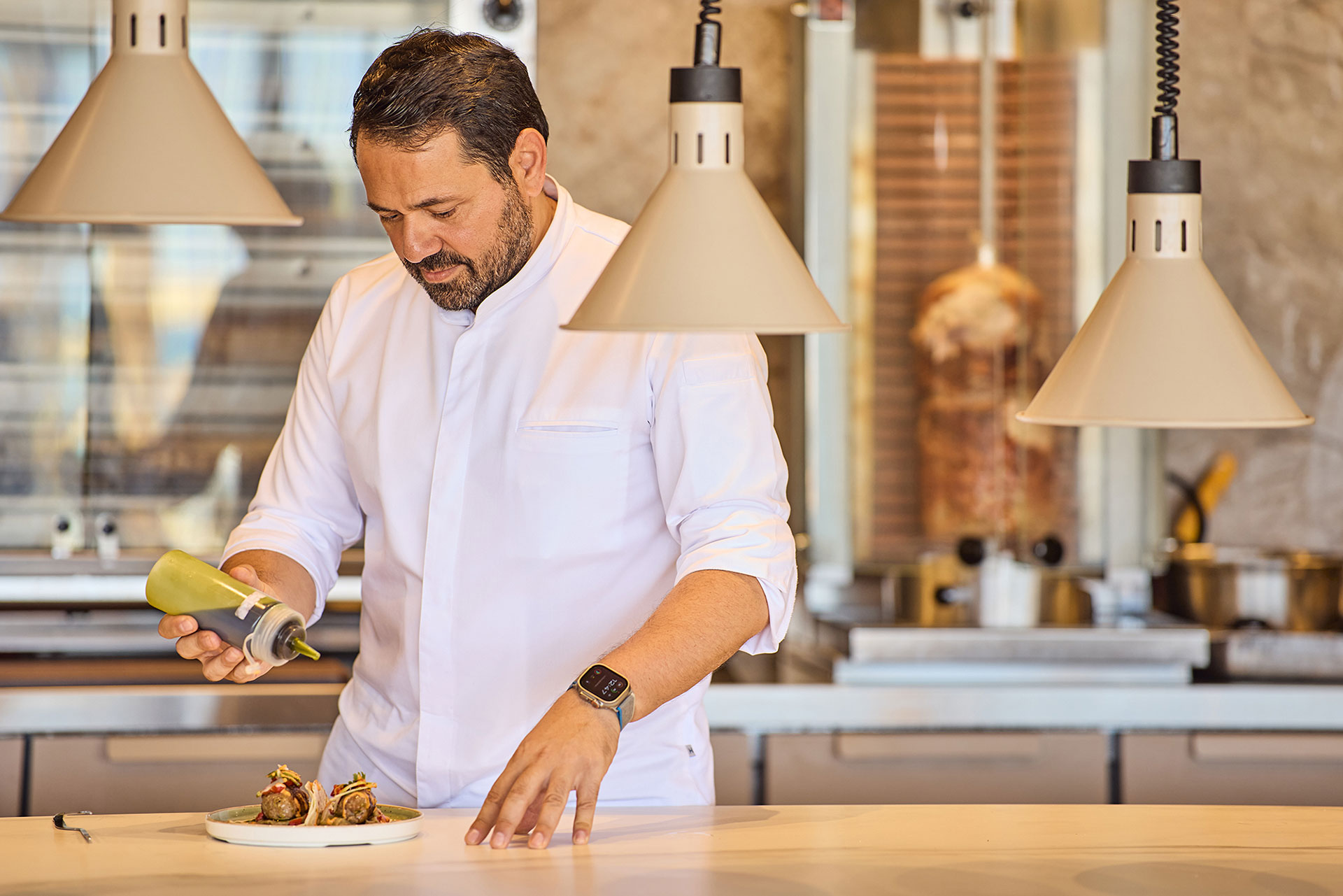 Paralos Kosta Alimia Greek Grill cook preparing a dish