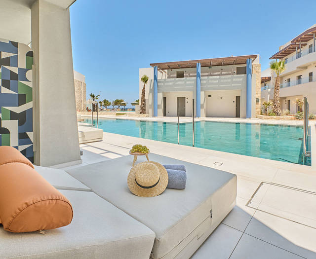 Swim-up junior suite with direct pool access, and sun loungers
