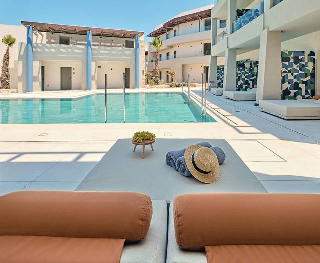 Swim-up junior suite with direct pool access, and sun loungers